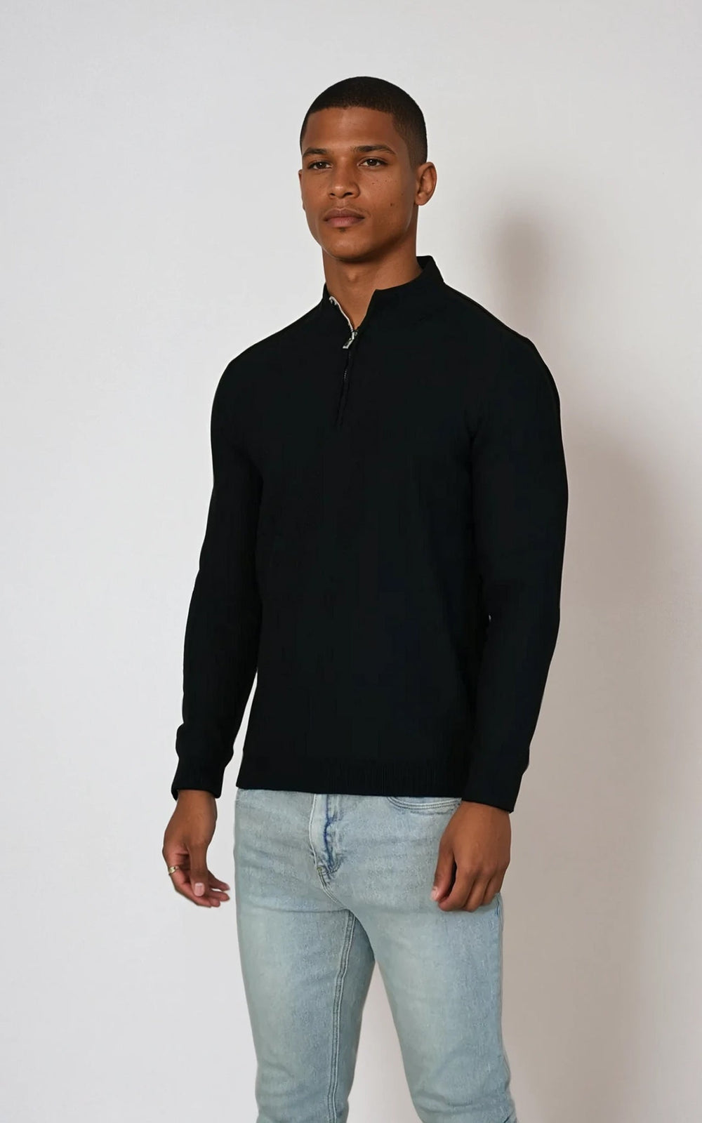 Black men's textured quarter zip knit jumper from Como, featuring a cozy knit fabric and a stylish half-zip design.